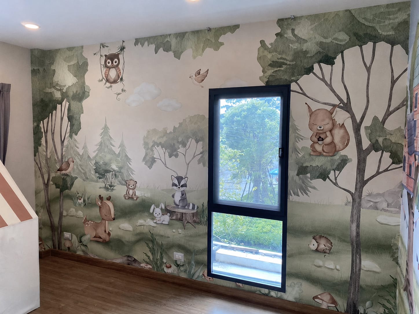 Woodland Joy mural fitted around the window wall of a children's bedroom
