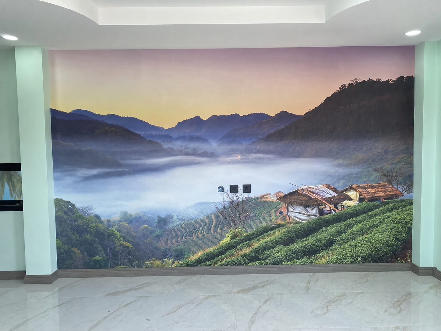 Misty mountain and tea terrace photo mural in a reception area