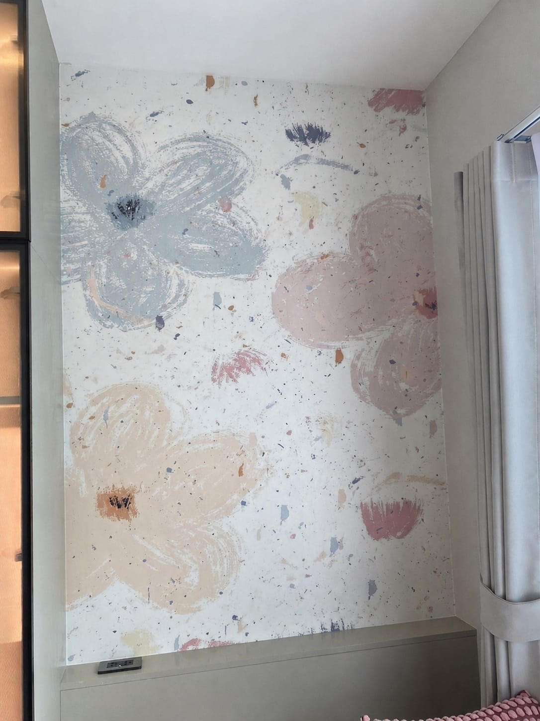 Soft pastel floral mural in a bedroom window nook