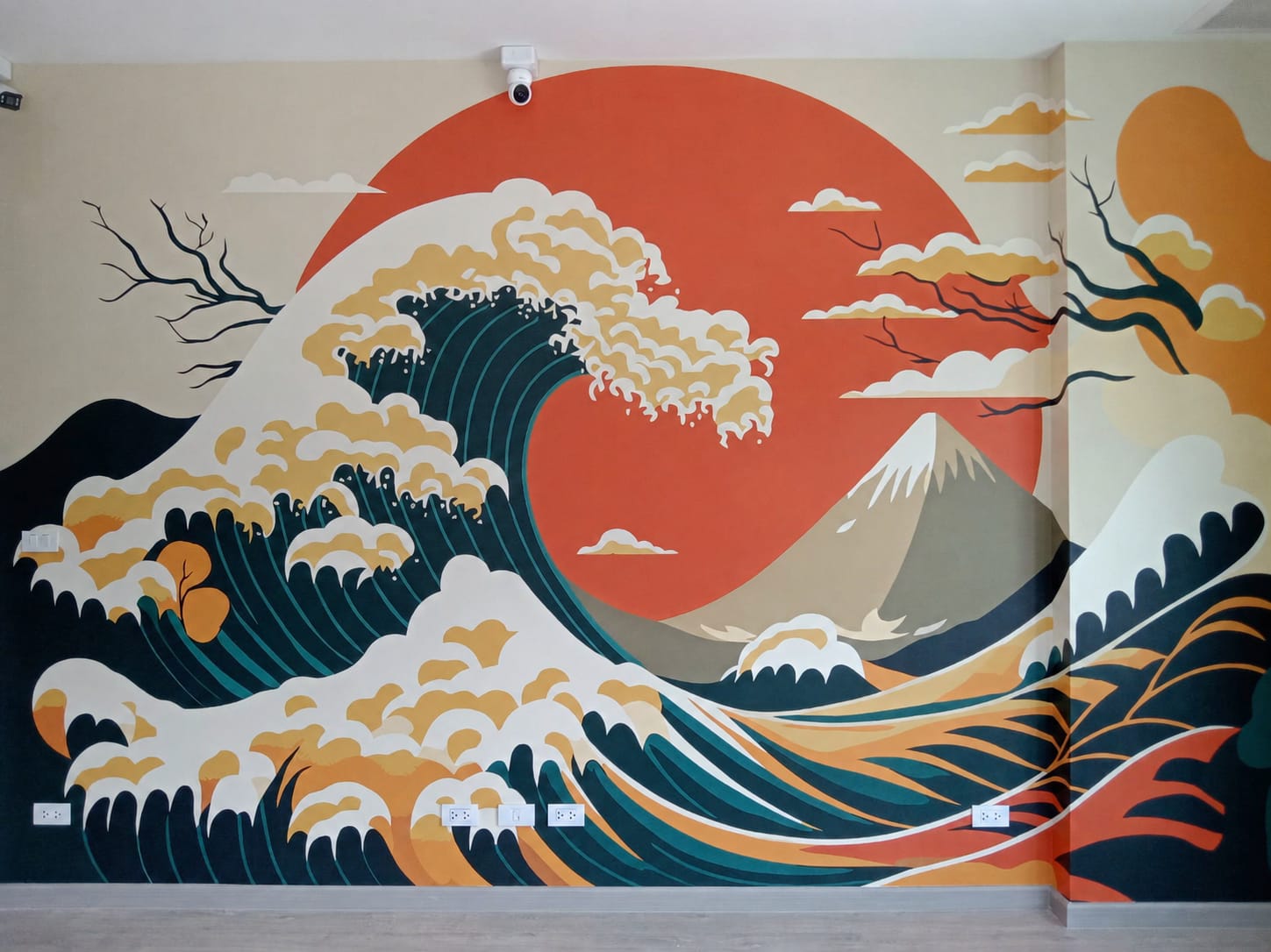 Japanese great wave mural with a red sun, wrapping the corner of a room